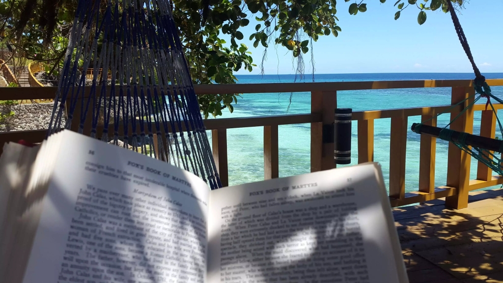 reading a book at a beachfront